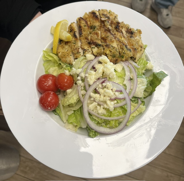 Cafe 51 Signature Salad with mixed greens, tomatoes, red onion, cheese blend, and marinated chicken
